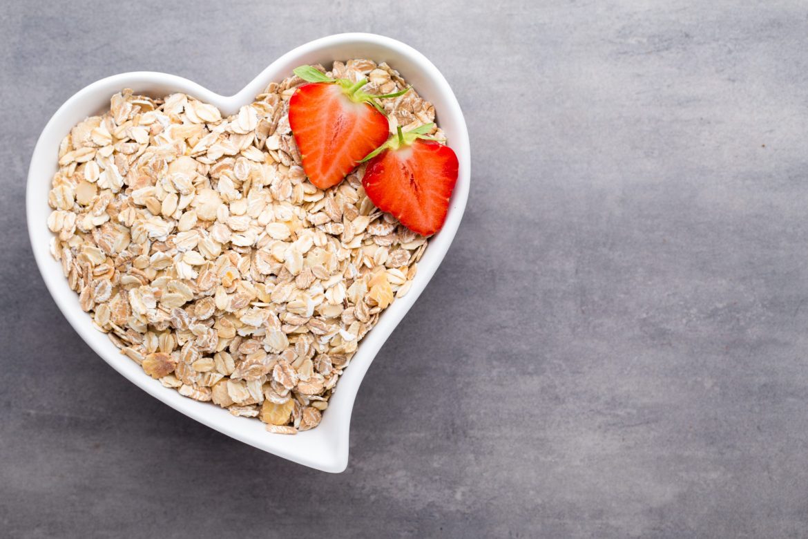 Fried oat flakes in a heart bowl.